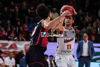 2024-01-24 - Davide Moretti #11 of Itelyum Varese (R) seen in action during FIBA Europe Cup 2023/24 Second Round Group N game between Itelyum Varese and Niners Chemnitz at Itelyum Arena, Varese, Italy on January 24, 2024 - ITELYUM VARESE VS NINERS CHEMNITZ - FIBA EUROPE CUP - BASKETBALL