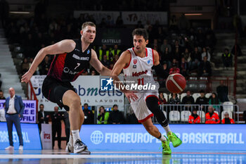 2024-01-24 - Davide Moretti #11 of Itelyum Varese competes for the ball against Jonas Richter #7 of Niners Chemnitz \during FIBA Europe Cup 2023/24 Second Round Group N game between Itelyum Varese and Niners Chemnitz at Itelyum Arena, Varese, Italy on January 24, 2024 - ITELYUM VARESE VS NINERS CHEMNITZ - FIBA EUROPE CUP - BASKETBALL