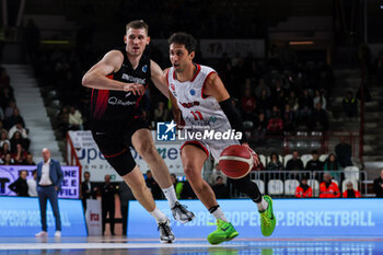 2024-01-24 - Davide Moretti #11 of Itelyum Varese (R) competes for the ball against Jonas Richter #7 of Niners Chemnitz (L) during FIBA Europe Cup 2023/24 Second Round Group N game between Itelyum Varese and Niners Chemnitz at Itelyum Arena, Varese, Italy on January 24, 2024 - ITELYUM VARESE VS NINERS CHEMNITZ - FIBA EUROPE CUP - BASKETBALL