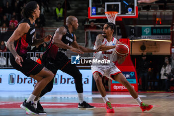 2024-01-24 - Olivier Hanlan #21 of Itelyum Varese (R) competes for the ball against Deandre Lansdowne #9 of Niners Chemnitz (C) and Kevin Yebo #53 of Niners Chemnitz (L) during FIBA Europe Cup 2023/24 Second Round Group N game between Itelyum Varese and Niners Chemnitz at Itelyum Arena, Varese, Italy on January 24, 2024 - ITELYUM VARESE VS NINERS CHEMNITZ - FIBA EUROPE CUP - BASKETBALL