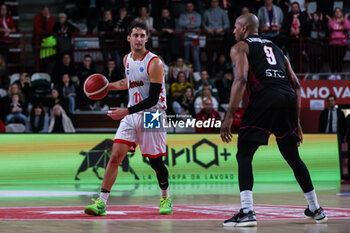 2024-01-24 - Davide Moretti #11 of Itelyum Varese (L) and Deandre Lansdowne #9 of Niners Chemnitz (R) seen in action during FIBA Europe Cup 2023/24 Second Round Group N game between Itelyum Varese and Niners Chemnitz at Itelyum Arena, Varese, Italy on January 24, 2024 - ITELYUM VARESE VS NINERS CHEMNITZ - FIBA EUROPE CUP - BASKETBALL
