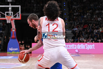 2024-02-22 - Nicolo Melli ( Italy ) thwarted by Sadik Emir Kabaca ( Turkiye ) during FIBA Euro Basket group B game between Italy and Turkiye  at Vitifrigo Arena in Pesaro, Italy on   February 22, 2024 - EUROBASKET 2025 QUALIFICATIONS - ITALY VS TURKEY - EVENTS - BASKETBALL