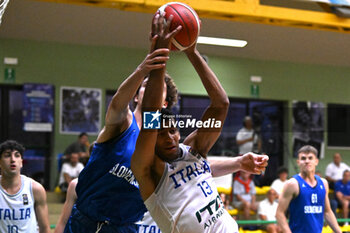 2024-07-05 - Actions of the game and players' images during the between Italy and Slovenia at Pala Cian Toma - Domegge (BL) 5 July, 2024 during the Torneo Under 20 - 22° Memorial De Silvestro/Trofeo Meneghin - TORNEO UNDER 20 - 22° MEMORIAL DE SILVESTRO/TROFEO MENEGHIN - ITALIA VS SLOVENIA - EVENTS - BASKETBALL