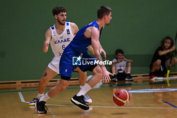 2024-07-06 - Actions of the game and players' images during the between Greece and Slovenija at Pala Cian Toma - Domegge (BL) 6 July, 2024 during the Torneo Under 20 - 22° Memorial De Silvestro/Trofeo Meneghin - TORNEO UNDER 20 - 22° MEMORIAL DE SILVESTRO/TROFEO MENEGHIN - GRECIA VS SLOVENIA - EVENTS - BASKETBALL