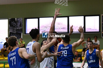 2024-07-06 - Actions of the game and players' images during the between Greece and Slovenija at Pala Cian Toma - Domegge (BL) 6 July, 2024 during the Torneo Under 20 - 22° Memorial De Silvestro/Trofeo Meneghin - TORNEO UNDER 20 - 22° MEMORIAL DE SILVESTRO/TROFEO MENEGHIN - GRECIA VS SLOVENIA - EVENTS - BASKETBALL