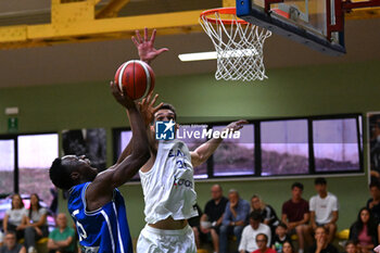 2024-07-07 - Emmanuel Innocenti (Italy ) twarted by Evangelos Iaonnou ( Greece ) during the match at Pala Cian Toma - Domegge (BL) 7 July, 2024, during the 22nd De Silvestro-Meneghin International U20 Basketball Tournament - TORNEO UNDER 20 - 22° MEMORIAL DE SILVESTRO/TROFEO MENEGHIN - ITALIA VS GRECIA - EVENTS - BASKETBALL