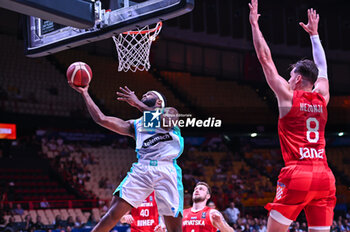 2024-07-02 - 9 Josh Nebo of Slovenia competing with 8 Mario Hezonja of Croatia during the FIBA Olympic Qualifying Tournament 2024, match between Slovenia and Croatia at Peace & Friendship Stadium on July 2, 2024, in Piraeus, Greece. - SLOVENIA VS CROATIA - FIBA OLYMPIC QUALIFYING TOURNAMENTS - INTERNATIONALS - BASKETBALL