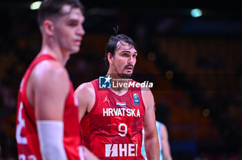 2024-07-02 - 9 Dario Saric of Croatia is playing during the FIBA Olympic Qualifying Tournament 2024, match between Slovenia and Croatia at Peace & Friendship Stadium on July 2, 2024, in Piraeus, Greece. - SLOVENIA VS CROATIA - FIBA OLYMPIC QUALIFYING TOURNAMENTS - INTERNATIONALS - BASKETBALL