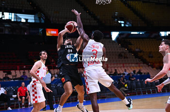 2024-07-03 - 51 Shea Ili of New Zealand competing with 3 Jaleen Smith of Croatia during the FIBA Olympic Qualifying Tournament 2024, match between Croatia and New Zealand at Peace & Friendship Stadium on July 3, 2024, in Piraeus, Greece. - CROATIA VS NEW ZEALAND - FIBA OLYMPIC QUALIFYING TOURNAMENTS - INTERNATIONALS - BASKETBALL