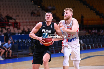 2024-07-03 - 5 Yanni Wetzell of New Zealand competing with 24 Dario Dreznjak of Croatia during the FIBA Olympic Qualifying Tournament 2024, match between Croatia and New Zealand at Peace & Friendship Stadium on July 3, 2024, in Piraeus, Greece. - CROATIA VS NEW ZEALAND - FIBA OLYMPIC QUALIFYING TOURNAMENTS - INTERNATIONALS - BASKETBALL