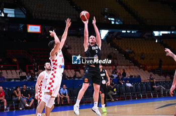 2024-07-03 - 3 Finn Delany of New Zealand is playing during the FIBA Olympic Qualifying Tournament 2024, match between Croatia and New Zealand at Peace & Friendship Stadium on July 3, 2024, in Piraeus, Greece. - CROATIA VS NEW ZEALAND - FIBA OLYMPIC QUALIFYING TOURNAMENTS - INTERNATIONALS - BASKETBALL