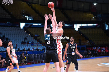 2024-07-03 - 9 Dario Saric of Croatia competing with 3 Finn Delany of New Zealand during the FIBA Olympic Qualifying Tournament 2024, match between Croatia and New Zealand at Peace & Friendship Stadium on July 3, 2024, in Piraeus, Greece. - CROATIA VS NEW ZEALAND - FIBA OLYMPIC QUALIFYING TOURNAMENTS - INTERNATIONALS - BASKETBALL