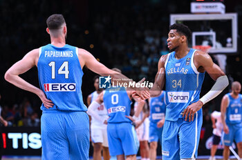 2024-07-03 - 34 Giannis Antetokounmpo of Greece with his teammate 14 Georgios Papagiannis during the FIBA Olympic Qualifying Tournament 2024, match between Dominican Republic and Greece at Peace & Friendship Stadium on July 3, 2024, in Piraeus, Greece. - DOMINICAN REPUBLIC VS GREECE - FIBA OLYMPIC QUALIFYING TOURNAMENTS - INTERNATIONALS - BASKETBALL