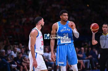 2024-07-03 - 34 Giannis Antetokounmpo of Greece with 27 Christopher Theoret Duarte of Dominican Republic during the FIBA Olympic Qualifying Tournament 2024, match between Dominican Republic and Greece at Peace & Friendship Stadium on July 3, 2024, in Piraeus, Greece. - DOMINICAN REPUBLIC VS GREECE - FIBA OLYMPIC QUALIFYING TOURNAMENTS - INTERNATIONALS - BASKETBALL