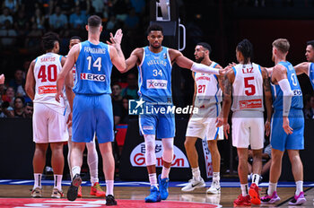 2024-07-03 - 34 Giannis Antetokounmpo of Greece with his teammates 14 Georgios Papagiannis and 0 Thomas Walkup during the FIBA Olympic Qualifying Tournament 2024, match between Dominican Republic and Greece at Peace & Friendship Stadium on July 3, 2024, in Piraeus, Greece. - DOMINICAN REPUBLIC VS GREECE - FIBA OLYMPIC QUALIFYING TOURNAMENTS - INTERNATIONALS - BASKETBALL