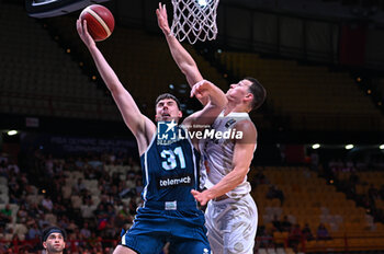 2024-07-04 - 31 Vlatko Cancar of Slovenia competing with 5 Yanni Wetzell of New Zealand during the FIBA Olympic Qualifying Tournament 2024, match between Slovenia and New Zealand at Peace & Friendship Stadium on July 4, 2024, in Piraeus, Greece. - NEW ZEALAND VS SLOVENIA - FIBA OLYMPIC QUALIFYING TOURNAMENTS - INTERNATIONALS - BASKETBALL