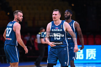 2024-07-04 - 15 Gregor Hvorat with 37 Leon Stergar of Slovenia during the FIBA Olympic Qualifying Tournament 2024, match between Slovenia and New Zealand at Peace & Friendship Stadium on July 4, 2024, in Piraeus, Greece. - NEW ZEALAND VS SLOVENIA - FIBA OLYMPIC QUALIFYING TOURNAMENTS - INTERNATIONALS - BASKETBALL