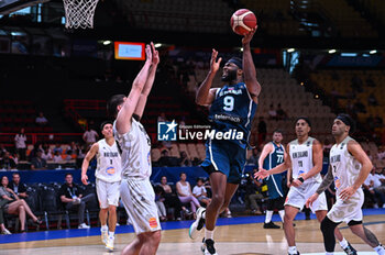 2024-07-04 - 9 Josh Nebo of Slovenia is playing during the FIBA Olympic Qualifying Tournament 2024, match between Slovenia and New Zealand at Peace & Friendship Stadium on July 4, 2024, in Piraeus, Greece. - NEW ZEALAND VS SLOVENIA - FIBA OLYMPIC QUALIFYING TOURNAMENTS - INTERNATIONALS - BASKETBALL