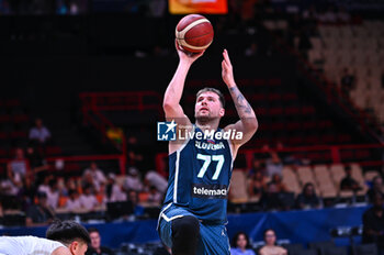 2024-07-04 - 77 Luka Doncic of Slovenia is playing during the FIBA Olympic Qualifying Tournament 2024, match between Slovenia and New Zealand at Peace & Friendship Stadium on July 4, 2024, in Piraeus, Greece. - NEW ZEALAND VS SLOVENIA - FIBA OLYMPIC QUALIFYING TOURNAMENTS - INTERNATIONALS - BASKETBALL