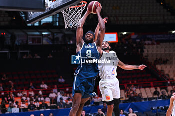 2024-07-04 - 9 Josh Nebo of Slovenia competing with 9 Corey Webster of New Zealand during the FIBA Olympic Qualifying Tournament 2024, match between Slovenia and New Zealand at Peace & Friendship Stadium on July 4, 2024, in Piraeus, Greece. - NEW ZEALAND VS SLOVENIA - FIBA OLYMPIC QUALIFYING TOURNAMENTS - INTERNATIONALS - BASKETBALL