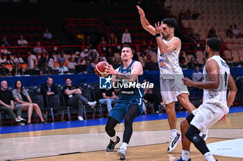 2024-07-04 - 15 Gregor Hvorat of Slovenia is playing during the FIBA Olympic Qualifying Tournament 2024, match between Slovenia and New Zealand at Peace & Friendship Stadium on July 4, 2024, in Piraeus, Greece. - NEW ZEALAND VS SLOVENIA - FIBA OLYMPIC QUALIFYING TOURNAMENTS - INTERNATIONALS - BASKETBALL