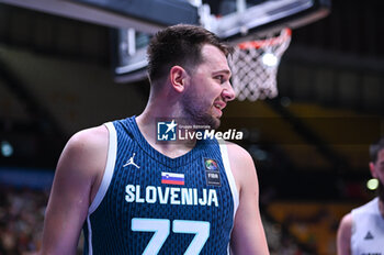 2024-07-04 - 77 Luka Doncic of Slovenia is playing during the FIBA Olympic Qualifying Tournament 2024, match between Slovenia and New Zealand at Peace & Friendship Stadium on July 4, 2024, in Piraeus, Greece. - NEW ZEALAND VS SLOVENIA - FIBA OLYMPIC QUALIFYING TOURNAMENTS - INTERNATIONALS - BASKETBALL