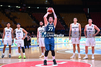 2024-07-04 - 77 Luka Doncic of Slovenia is playing during the FIBA Olympic Qualifying Tournament 2024, match between Slovenia and New Zealand at Peace & Friendship Stadium on July 4, 2024, in Piraeus, Greece. - NEW ZEALAND VS SLOVENIA - FIBA OLYMPIC QUALIFYING TOURNAMENTS - INTERNATIONALS - BASKETBALL