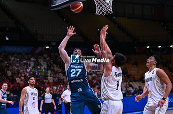 2024-07-04 - 27 Ziga Dimec of Slovenia competing with 1 Reuben Te Rangi of New Zealand during the FIBA Olympic Qualifying Tournament 2024, match between Slovenia and New Zealand at Peace & Friendship Stadium on July 4, 2024, in Piraeus, Greece. - NEW ZEALAND VS SLOVENIA - FIBA OLYMPIC QUALIFYING TOURNAMENTS - INTERNATIONALS - BASKETBALL