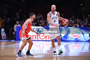 2024-07-04 - 8 Nick Calathes of Greece is playing during the FIBA Olympic Qualifying Tournament 2024, match between Egypt and Greece at Peace & Friendship Stadium on July 4, 2024, in Piraeus, Greece. - GREECE VS EGYPT - FIBA OLYMPIC QUALIFYING TOURNAMENTS - INTERNATIONALS - BASKETBALL