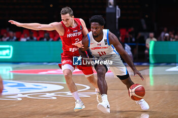 2024-07-06 - 10 Andres Feliz of Dominican Republic competing with 2 Goran Filipovic of Croatia during the FIBA Olympic Qualifying Tournament 2024 Semi Final match between Dominican Republic and Croatia at Peace & Friendship Stadium on July 6, 2024, in Piraeus, Greece. - DOMINICAN REPUBLIC VS CROATIA - SEMI FINALS, FIBA OLYMPIC QUALIFYING TOURNAMENTS - INTERNATIONALS - BASKETBALL