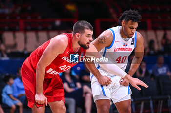 2024-07-06 - 40 Ivica Zubac of Croatia competing with 40 Luis Santos of Dominican Republic during the FIBA Olympic Qualifying Tournament 2024 Semi Final match between Dominican Republic and Croatia at Peace & Friendship Stadium on July 6, 2024, in Piraeus, Greece. - DOMINICAN REPUBLIC VS CROATIA - SEMI FINALS, FIBA OLYMPIC QUALIFYING TOURNAMENTS - INTERNATIONALS - BASKETBALL