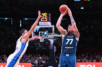 2024-07-06 - 77 Luka Doncic of Slovenia competing with 5 Giannoulis Larentzakis of Greece during the FIBA Olympic Qualifying Tournament 2024 Semi Final match between Greece and Slovenia at Peace & Friendship Stadium on July 6, 2024, in Piraeus, Greece. - GREECE VS SLOVENIA - SEMI FINALS, FIBA OLYMPIC QUALIFYING TOURNAMENTS - INTERNATIONALS - BASKETBALL