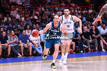 2024-07-06 - 7 Klemen Prepelic of Slovenia competing with 16 Kostas Papanikolaou of Greece during the FIBA Olympic Qualifying Tournament 2024 Semi Final match between Greece and Slovenia at Peace & Friendship Stadium on July 6, 2024, in Piraeus, Greece. - GREECE VS SLOVENIA - SEMI FINALS, FIBA OLYMPIC QUALIFYING TOURNAMENTS - INTERNATIONALS - BASKETBALL