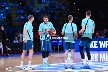 2024-07-06 - Slovenian players during the FIBA Olympic Qualifying Tournament 2024 Semi Final match between Greece and Slovenia at Peace & Friendship Stadium on July 6, 2024, in Piraeus, Greece. - GREECE VS SLOVENIA - SEMI FINALS, FIBA OLYMPIC QUALIFYING TOURNAMENTS - INTERNATIONALS - BASKETBALL