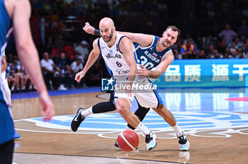 2024-07-06 - 8 Nick Calathes of Greece competing with 30 Zoran Dragic of Slovenia during the FIBA Olympic Qualifying Tournament 2024 Semi Final match between Greece and Slovenia at Peace & Friendship Stadium on July 6, 2024, in Piraeus, Greece. - GREECE VS SLOVENIA - SEMI FINALS, FIBA OLYMPIC QUALIFYING TOURNAMENTS - INTERNATIONALS - BASKETBALL