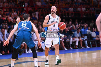 2024-07-06 - 8 Nick Calathes of Greece is playing during the FIBA Olympic Qualifying Tournament 2024 Semi Final match between Greece and Slovenia at Peace & Friendship Stadium on July 6, 2024, in Piraeus, Greece. - GREECE VS SLOVENIA - SEMI FINALS, FIBA OLYMPIC QUALIFYING TOURNAMENTS - INTERNATIONALS - BASKETBALL