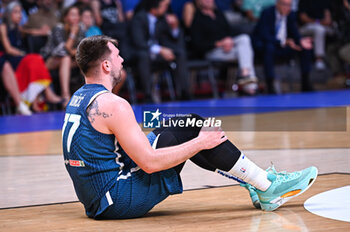 2024-07-06 - 77 Luka Doncic of Slovenia is playing during the FIBA Olympic Qualifying Tournament 2024 Semi Final match between Greece and Slovenia at Peace & Friendship Stadium on July 6, 2024, in Piraeus, Greece. - GREECE VS SLOVENIA - SEMI FINALS, FIBA OLYMPIC QUALIFYING TOURNAMENTS - INTERNATIONALS - BASKETBALL