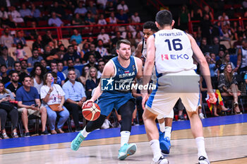 2024-07-06 - 77 Luka Doncic of Slovenia competing with 34 Giannis Antetokounmpo of Greece during the FIBA Olympic Qualifying Tournament 2024 Semi Final match between Greece and Slovenia at Peace & Friendship Stadium on July 6, 2024, in Piraeus, Greece. - GREECE VS SLOVENIA - SEMI FINALS, FIBA OLYMPIC QUALIFYING TOURNAMENTS - INTERNATIONALS - BASKETBALL