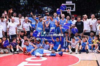 2024-07-07 - Players of Greece celebrating the ticket to the Olympic Games of Paris 2024 during the FIBA Olympic Qualifying Tournament 2024 Final match between Croatia and Greece at Peace & Friendship Stadium on July 7, 2024, in Piraeus, Greece. - CROATIA VS GREECE - FINAL, FIBA OLYMPIC QUALIFYING TOURNAMENTS - INTERNATIONALS - BASKETBALL