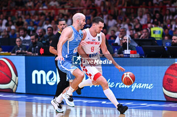 2024-07-07 - 8 Mario Hezonja of Croatia competing with 8 Nick Calathes of Greece during the FIBA Olympic Qualifying Tournament 2024 Final match between Croatia and Greece at Peace & Friendship Stadium on July 7, 2024, in Piraeus, Greece. - CROATIA VS GREECE - FINAL, FIBA OLYMPIC QUALIFYING TOURNAMENTS - INTERNATIONALS - BASKETBALL