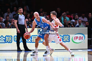 2024-07-07 - 8 Nick Calathes of Greece competing with 2 Goran Filipovic of Croatia during the FIBA Olympic Qualifying Tournament 2024 Final match between Croatia and Greece at Peace & Friendship Stadium on July 7, 2024, in Piraeus, Greece. - CROATIA VS GREECE - FINAL, FIBA OLYMPIC QUALIFYING TOURNAMENTS - INTERNATIONALS - BASKETBALL