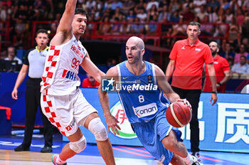 2024-07-07 - 8 Nick Calathes of Greece competing with 99 Toni Nakic of Croatia during the FIBA Olympic Qualifying Tournament 2024 Final match between Croatia and Greece at Peace & Friendship Stadium on July 7, 2024, in Piraeus, Greece. - CROATIA VS GREECE - FINAL, FIBA OLYMPIC QUALIFYING TOURNAMENTS - INTERNATIONALS - BASKETBALL