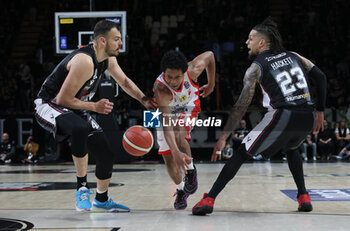 2024-04-01 - Charlie Edward Moore (Estra Pistoia) in action thwarted by Ante Zizic (Segafredo Virtus Bologna) (L) and Daniel Hackett (Segafredo Virtus Bologna) during the LBA italian A1 series basketball championship match Segafredo Virtus Bologna Vs. Estra Pistoia at Segafredo Arena, Bologna, Italy, April 01, 2024 - Photo: Michele Nucci - VIRTUS SEGAFREDO BOLOGNA VS ESTRA PISTOIA - ITALIAN SERIE A - BASKETBALL