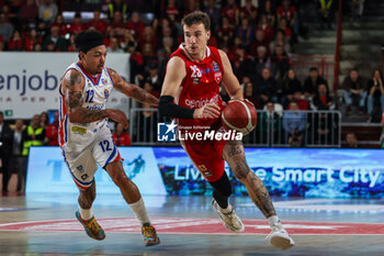 2024-04-28 - Hugo Besson #25 of Pallacanestro Varese OpenJobMetis (R) competes for the ball against Justin Robinson #12 of Nutribullet Treviso Basket (L) during LBA Lega Basket A 2023/24 Regular Season game between Pallacanestro Varese OpenJobMetis and Nutribullet Treviso Basket at Itelyum Arena, Varese, Italy on April 28, 2024 - OPENJOBMETIS VARESE VS NUTRIBULLET TREVISO BASKET - ITALIAN SERIE A - BASKETBALL