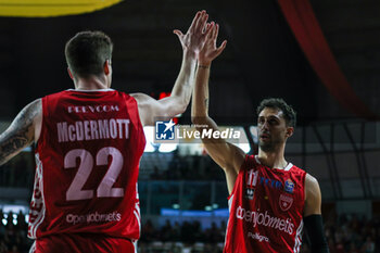 28/04/2024 - Davide Moretti #11 of Pallacanestro Varese OpenJobMetis (R) high five with Sean Mcdermott #22 of Pallacanestro Varese OpenJobMetis (L) during LBA Lega Basket A 2023/24 Regular Season game between Pallacanestro Varese OpenJobMetis and Nutribullet Treviso Basket at Itelyum Arena, Varese, Italy on April 28, 2024 - OPENJOBMETIS VARESE VS NUTRIBULLET TREVISO BASKET - SERIE A ITALIA - BASKET