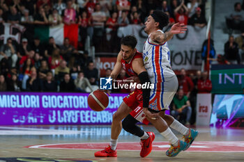 2024-04-28 - Davide Moretti #11 of Pallacanestro Varese OpenJobMetis (L) competes for the ball against Justin Robinson #12 of Nutribullet Treviso Basket (R) during LBA Lega Basket A 2023/24 Regular Season game between Pallacanestro Varese OpenJobMetis and Nutribullet Treviso Basket at Itelyum Arena, Varese, Italy on April 28, 2024 - OPENJOBMETIS VARESE VS NUTRIBULLET TREVISO BASKET - ITALIAN SERIE A - BASKETBALL