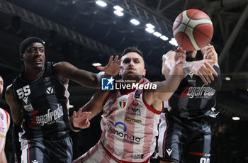 2024-06-06 - 
Stefano Tonut (Milano) in action thwarted by \Awudu Abass (Bologna) and Isaia Cordinier (Bologna) during race 1 of the playoffs final game of the LBA Italian basketball championship Segafredo Virtus Bologna vs EA7 Emporio Armani Olimpia Milano at Segafredo Arena, Bologna, Italy, June 06, 2024 - photo Michele Nucci - RACE 1 FINAL / VIRTUS SEGAFREDO BOLOGNA VS EA7 EMPORIO ARMANI MILANO - ITALIAN SERIE A - BASKETBALL