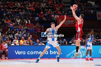 2024-10-06 - Nenad Dimitrijvevic (EA7 Emporio Armani Olimpia Milano) 3 points shoot & Luca Vincini (Banco di Sardegna Sassari) - EA7 EMPORIO ARMANI MILANO VS BANCO DI SARDEGNA SASSARI - ITALIAN SERIE A - BASKETBALL