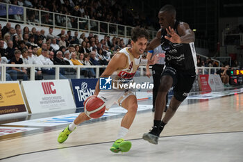 2024-10-05 - Davide Moretti of Umana Reyer Venezia carries the ball during the match between Dolomiti Energia Trentino and Umana Reyer Venezia, regular season of LBA UnipolSai A1 Italian Basketball Championship 2024/2025 at il T Quotidiano Arena on October 5, 2024, Trento, Italy. - DOLOMITI ENERGIA TRENTINO VS UMANA REYER VENEZIA - ITALIAN SERIE A - BASKETBALL