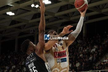 2024-10-05 - Amedeo Tessitori of Umana Reyer Venezia contrasted by Jordan Bayehe of Dolomiti Energia Trentino during the match between Dolomiti Energia Trentino and Umana Reyer Venezia, regular season of LBA UnipolSai A1 Italian Basketball Championship 2024/2025 at il T Quotidiano Arena on October 5, 2024, Trento, Italy. - DOLOMITI ENERGIA TRENTINO VS UMANA REYER VENEZIA - ITALIAN SERIE A - BASKETBALL